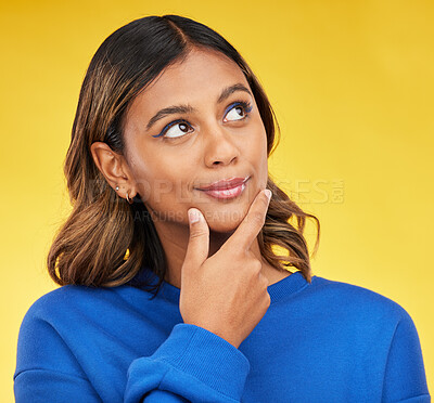 Buy stock photo Thinking, idea and young woman in a studio with a dreaming, choice or brainstorming facial expression. Remember, thoughtful and Indian female model with planning or decision face by yellow background