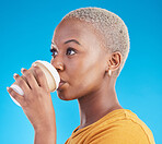 Thinking, drink or black woman with coffee on blue background to relax, chill and enjoy a beverage. Cappuccino latte, break or African girl on break with tea, caffeine or vision of future in studio 