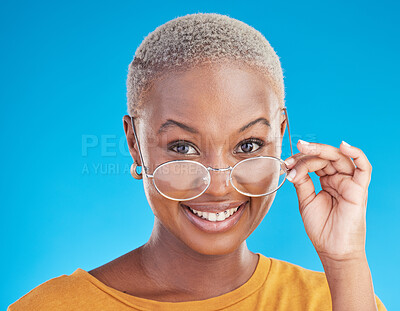 Buy stock photo Happy, portrait and black woman with glasses on a blue background for stylish, trendy and fashion. Cool, smile and headshot of an African girl or optometry model with eyewear for vision and eye care