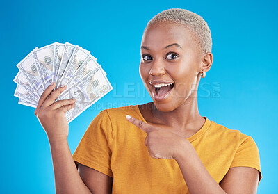 Buy stock photo Black woman, pointing at cash fan and surprise with finance, payment and lottery win isolated on blue background. Female person with wow face, money and financial freedom, dollar bills in a studio