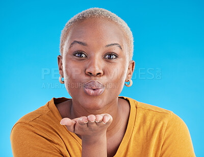 Buy stock photo Blowing kiss, blue background and portrait of black woman with emoji for affection, flirt and love. Happy, beauty and face of female person with hand sign for romance, confidence and relax in studio