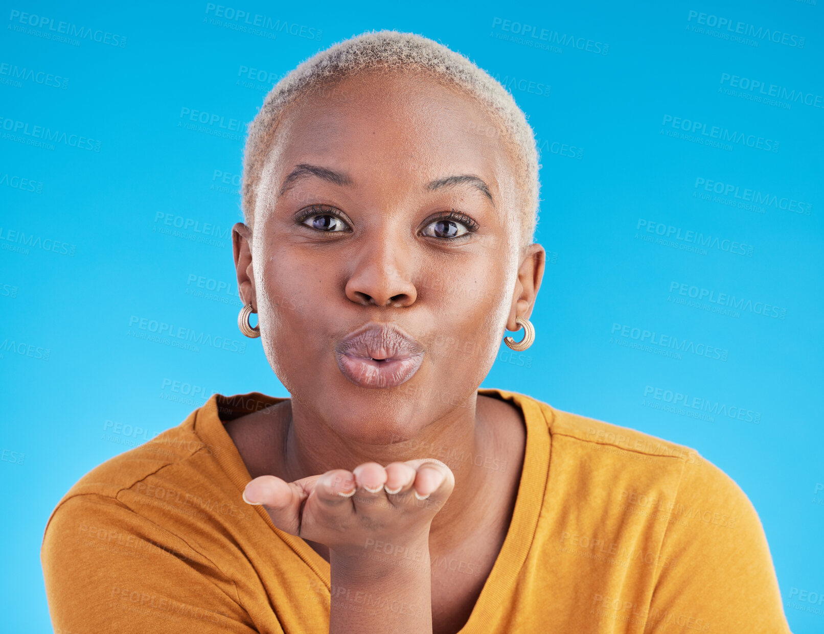 Buy stock photo Blowing kiss, blue background and portrait of black woman with emoji for affection, flirt and love. Happy, beauty and face of female person with hand sign for romance, confidence and relax in studio