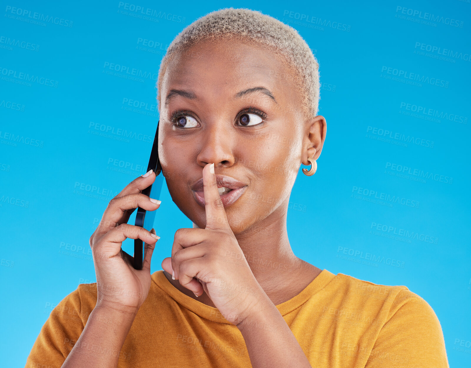 Buy stock photo Phone call, secret or finger on lips of black woman in studio for mystery, gossip or conversation. Privacy, news or whisper with girl or shush gesture on blue background for rumor, drama or silence