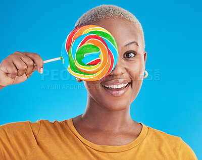 Buy stock photo Portrait, cover and black woman with a lollipop, candy and happiness on a blue studio background. Face, happy female person and African model with sugar treats, confectionary and cheerful girl