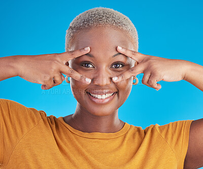 Buy stock photo Face, peace sign or happy black woman in studio isolated on blue background with smile or confidence. Portrait, happy gen z girl model or excited African female person with v symbol or hand gesture