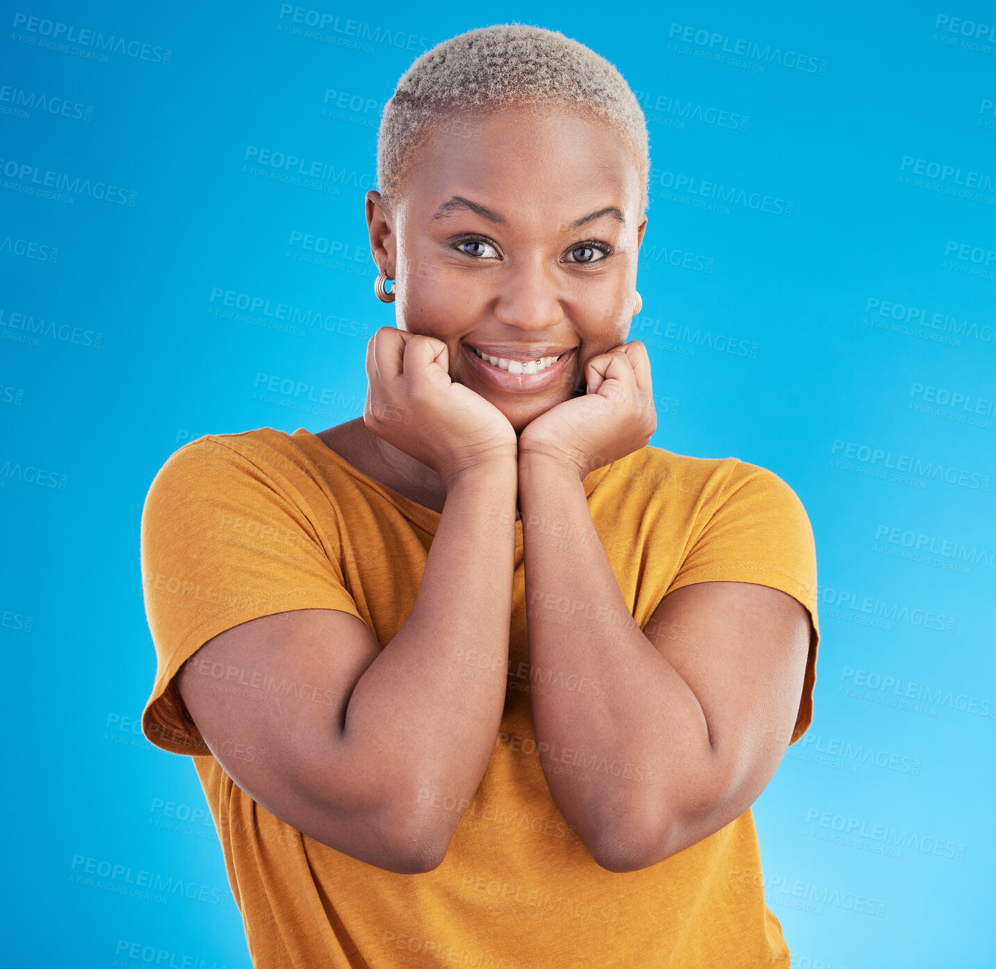Buy stock photo Portrait, smile and fashion with a black woman on a blue background in studio for trendy clothes style. Happy, beautiful and confidence with a young female person posing in a relaxed clothing outfit