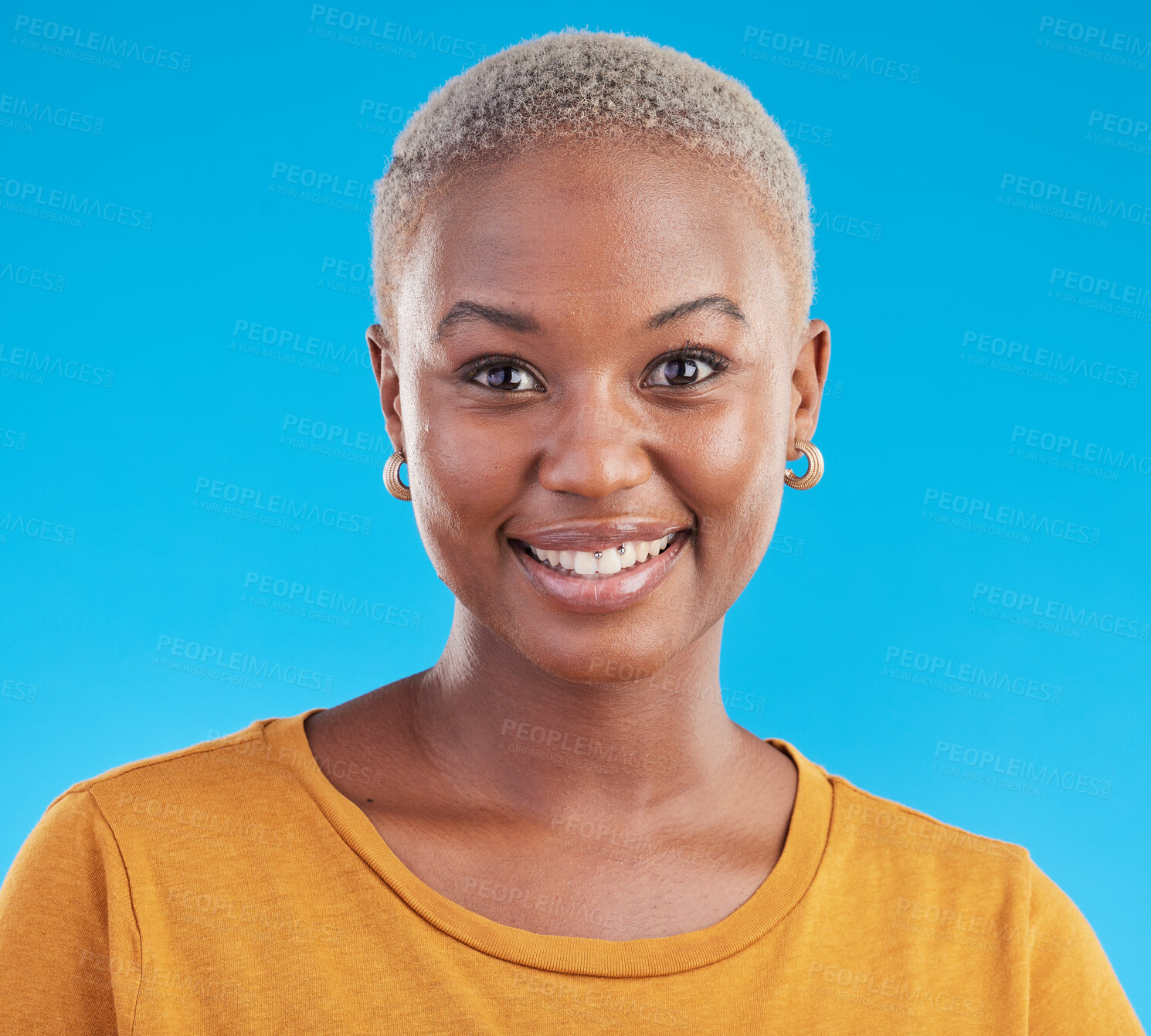 Buy stock photo Face, fashion and happy black woman in tshirt isolated on a blue studio background. Portrait, smile and young African person, model or girl from Kenya with style and confidence in casual clothes