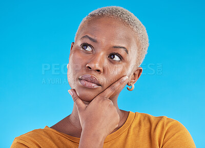 Buy stock photo Thinking, decision and black woman with ideas, opportunity and planning on a blue studio background. Person, girl and model with problem solving, solution and question with choice and mockup space