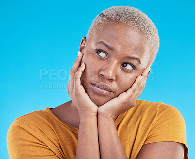 Buy stock photo Thinking, sad and black woman with depression, decision or solution on a blue studio background. Person, alone or model with problem solving, thoughts or anxiety with mental health, unhappy or choice