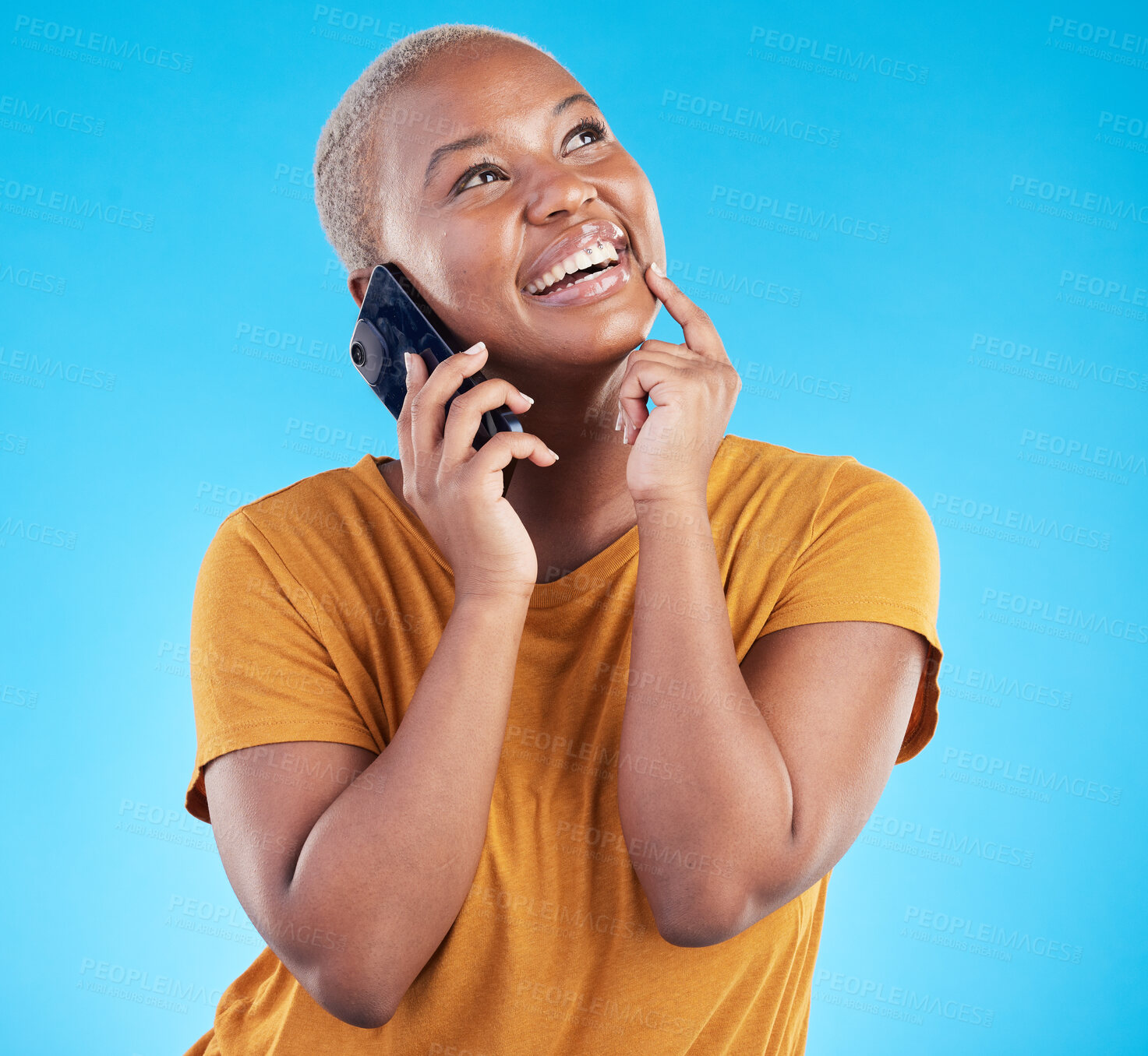 Buy stock photo Happy woman, phone call and ideas or university decision, listening to news and feedback on a blue, studio background. African person or student on mobile communication, thinking and future planning