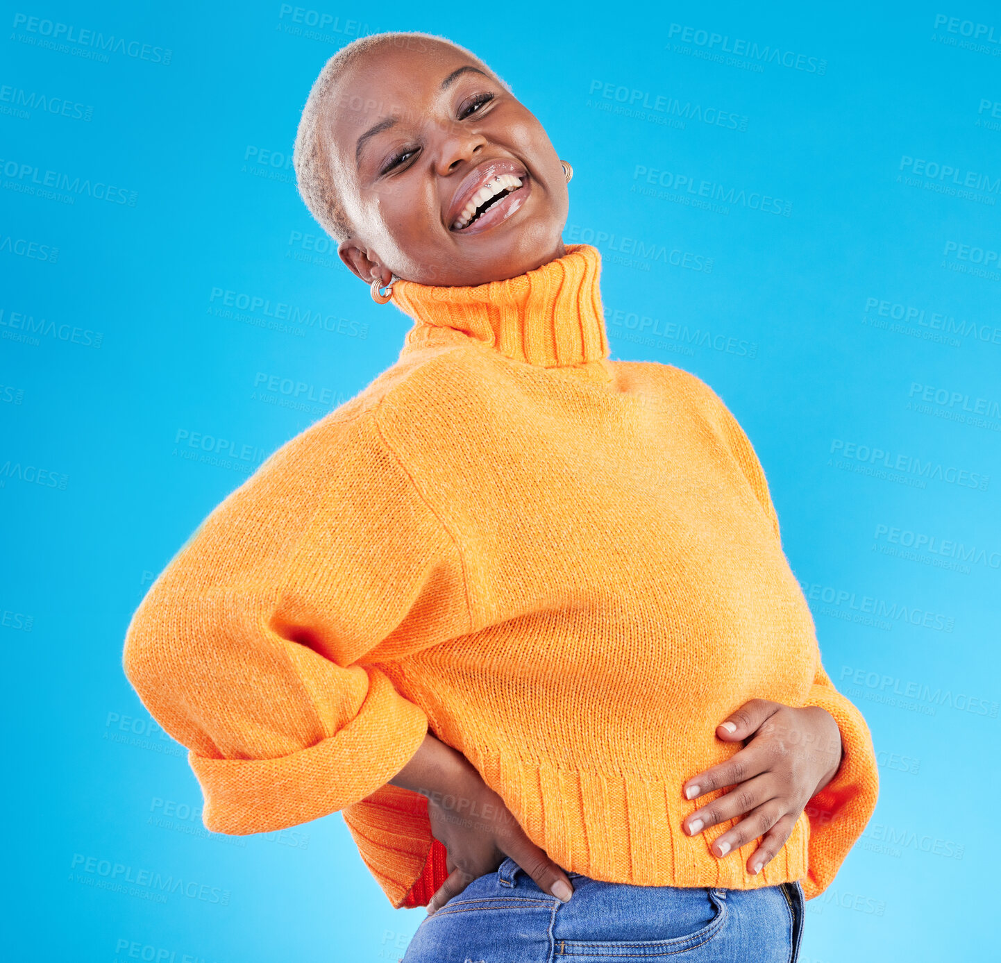 Buy stock photo Studio, blue background and happy African woman with fashion, natural beauty and confidence in casual style or clothes. Portrait, smile and person with happiness in winter clothing or college student