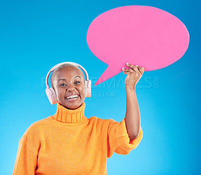 Buy stock photo Speech bubble, headphones or portrait of black woman in studio or communication with mockup space. Talking, smile or happy girl on social media for music review, feedback or board on blue background
