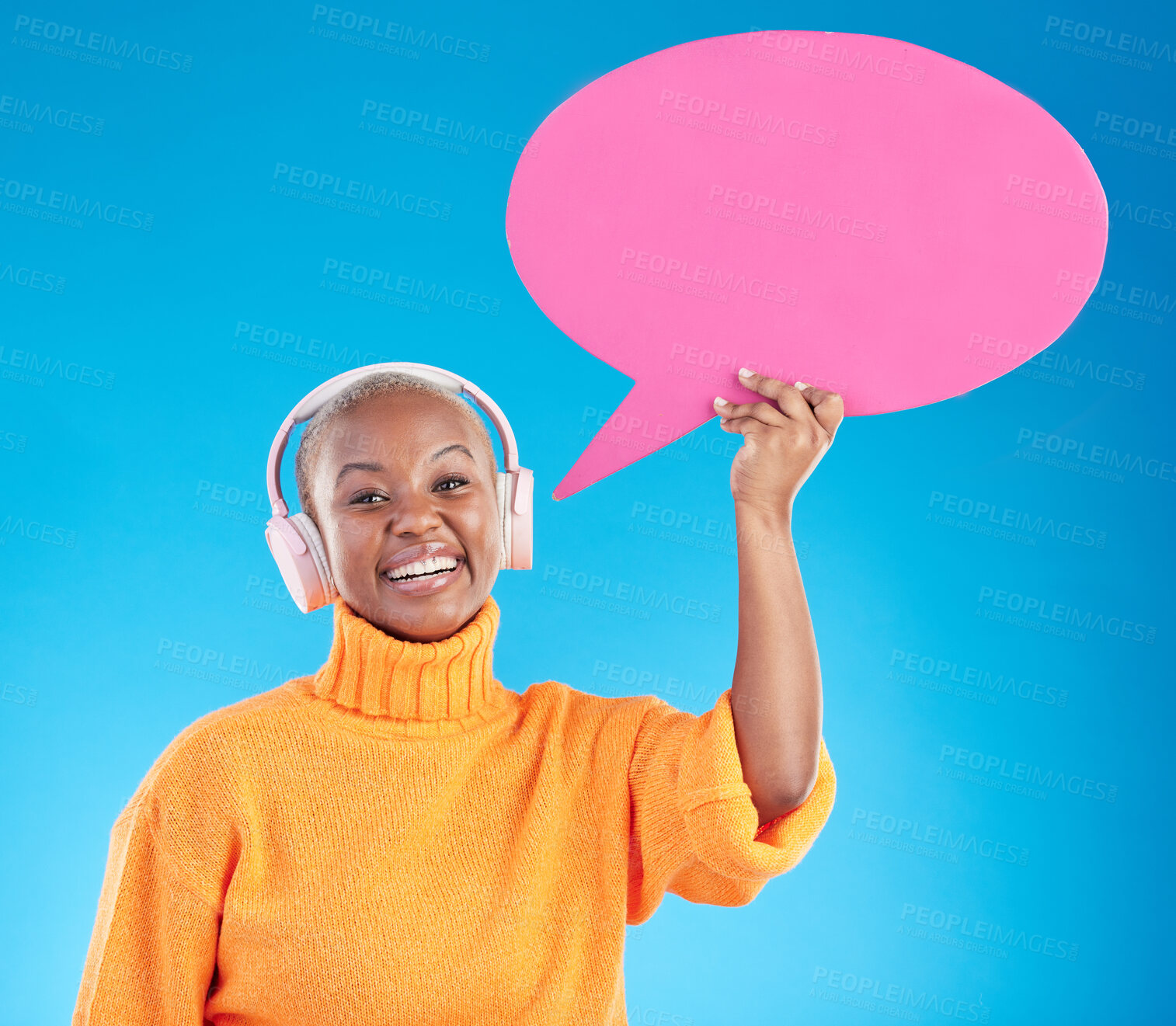 Buy stock photo Speech bubble, headphones or portrait of black woman in studio or communication with mockup space. Talking, smile or happy girl on social media for music review, feedback or board on blue background