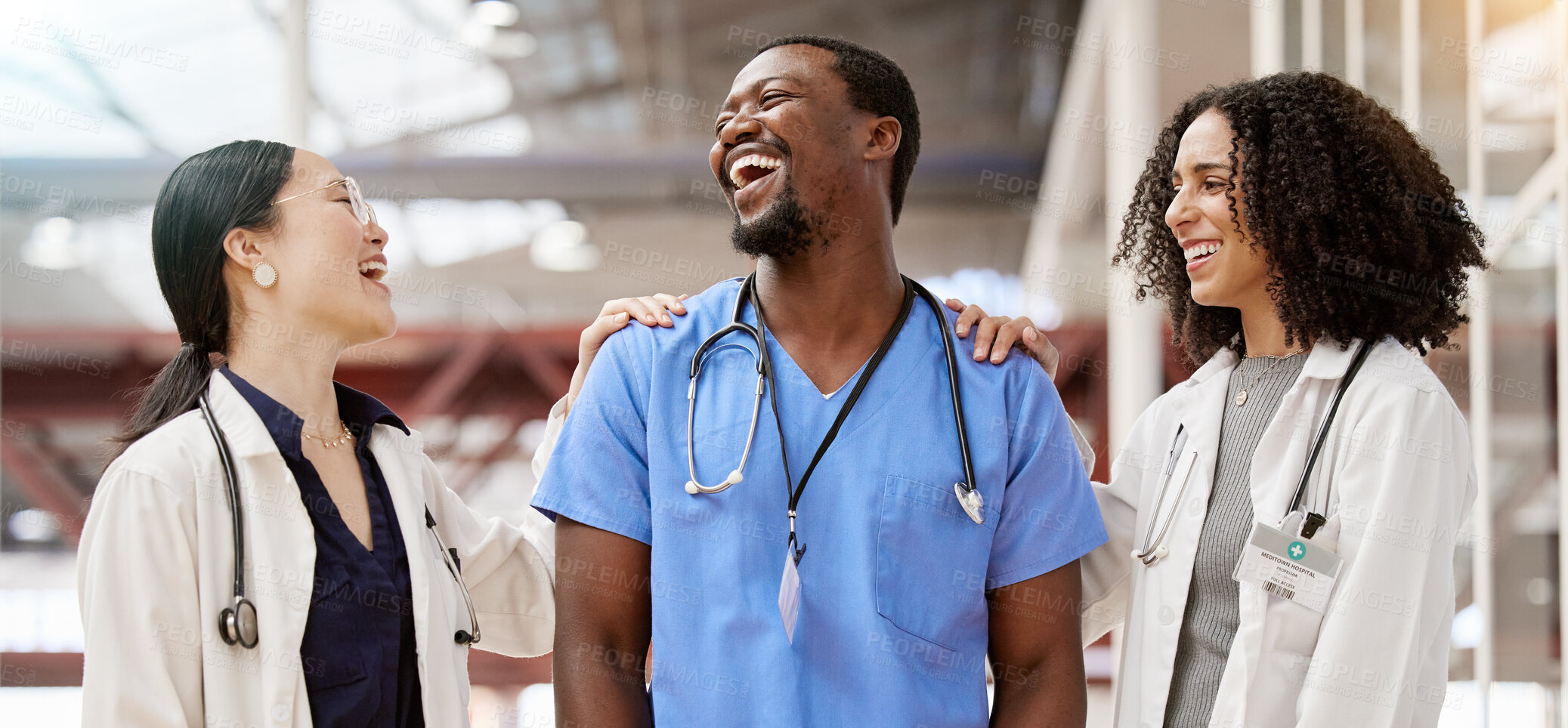 Buy stock photo Doctors, healthcare and medical team laughing together in a hospital with teamwork and collaboration. Diversity, happy and professional man and women with support, funny joke and career in medicine