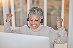 Computer, success and a senior woman in a call center for customer service, support or motivation. Contact, headset and a happy female consultant in celebration at a desk in a professional crm office