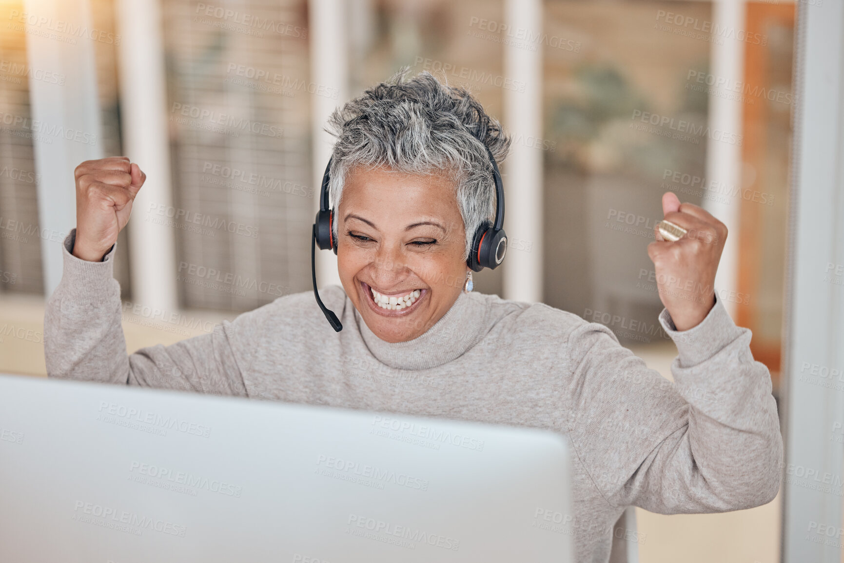 Buy stock photo Computer, success and a senior woman in a call center for customer service, support or motivation. Contact, headset and a happy female consultant in celebration at a desk in a professional crm office
