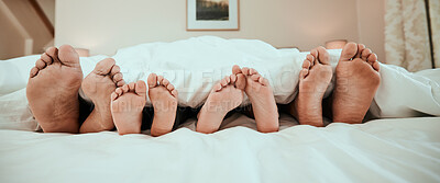 Buy stock photo Sleeping, feet and family in bed relax, peaceful and enjoying. a nap in their home together. Foot, sleep and children resting with in parents in a bedroom with love, safety and or vacation freedom