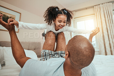Buy stock photo Dad, child and playing on bed flying for fun, quality time or bonding together in home, bedroom or girl in airplane game. Happy, father and daughter in air with knees and arms raised with freedom
