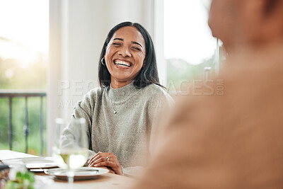 Buy stock photo Smile, dinner and woman laughing or happy at a table for a gathering event in a funny family home at lunch. Joke, happiness and young person at a celebration with unity meal or supper in dining room