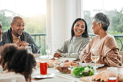 Buy stock photo Smile, food and relax with big family in dining room for lunch, happy and holiday celebration. Thanksgiving, party and dinner with people laughing at table in home for nutrition, happiness and love