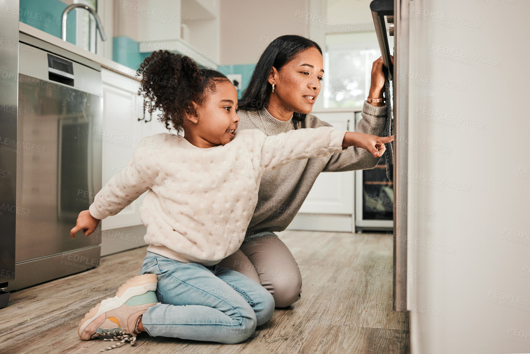 Buy stock photo Oven, teaching and parent cooking with child in kitchen for development, care and learning a recipe together at home. Stove, curious and kid help mom or mother prepare food, meal or baking in house