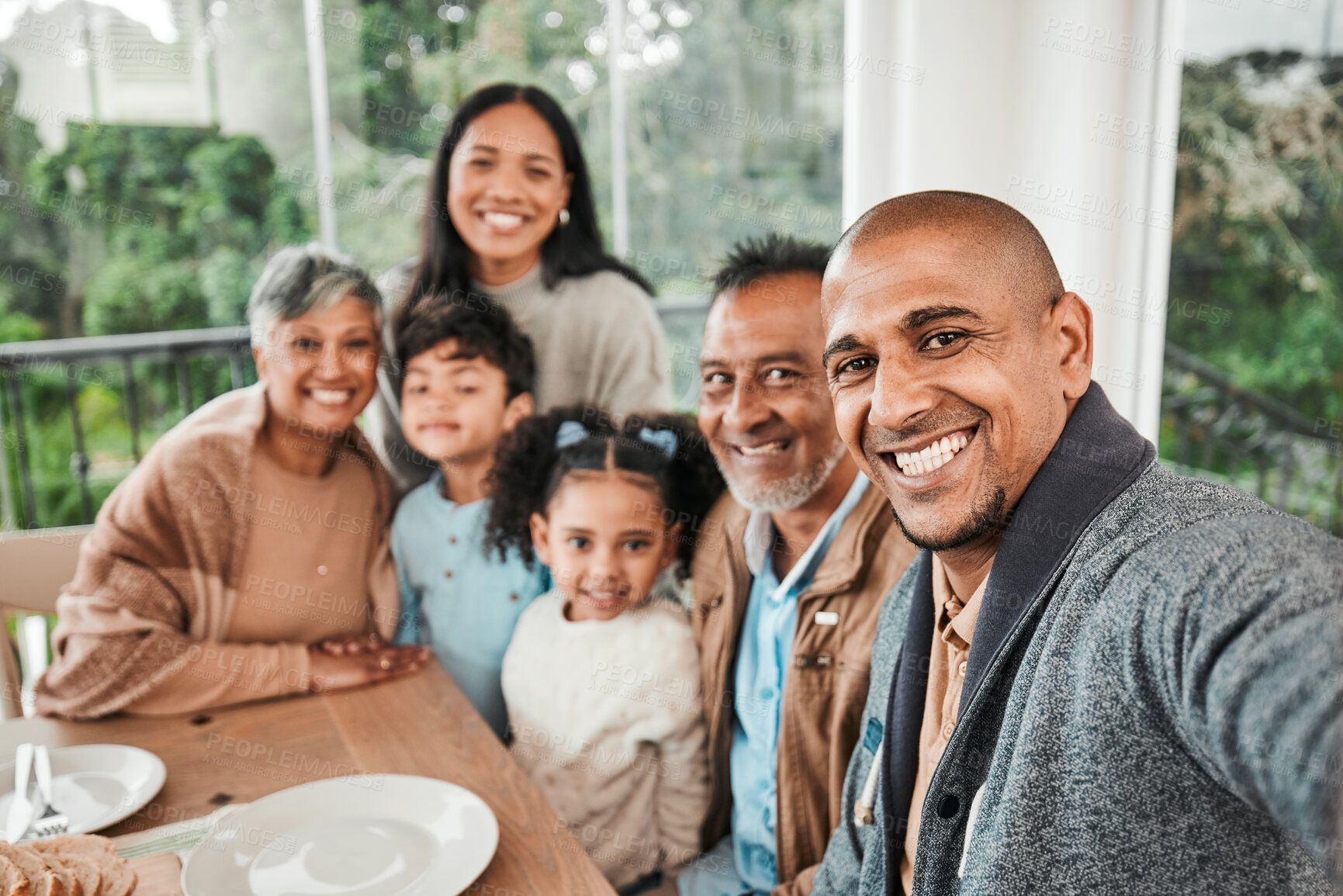 Buy stock photo Family, portrait and smile for selfie at lunch, dinner or celebration together at home. Happy generations of kids, parents and grandparents in profile picture, quality time or reunion at dining table