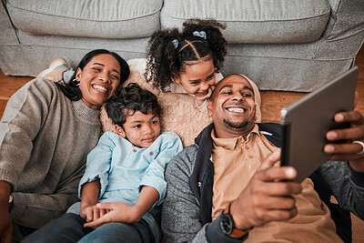 Buy stock photo Family, children and parents on tablet for video, movie or cartoon streaming on internet subscription and living room floor. Home, selfie and happy mom, dad and interracial kids on digital technology