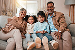Family, grandparents and grandkids smile in portrait, bonding with love and care at home. Old man, woman and children in living room, relax on sofa with happiness, weekend with youth and retirement