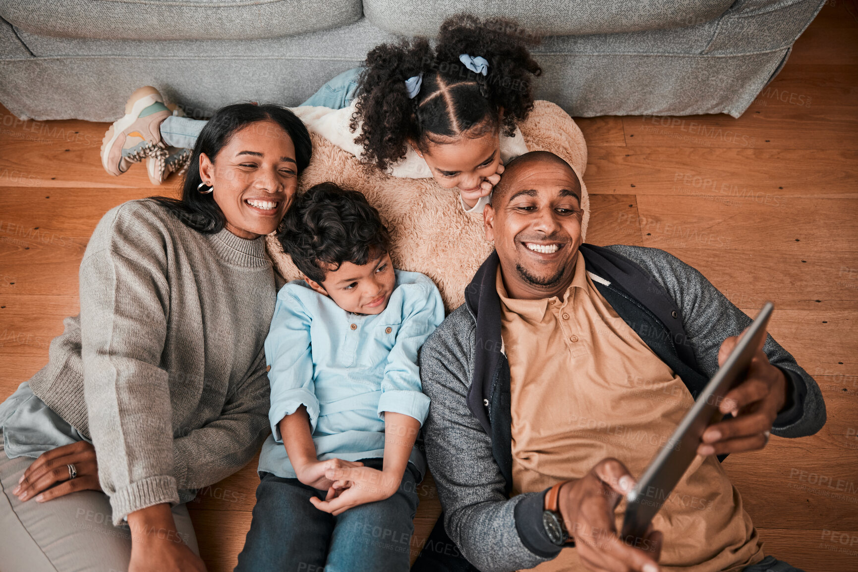 Buy stock photo Happy family, children and parents on tablet for selfie, video or movie streaming on internet subscription on living room floor. Home, relax and mom, dad and interracial kids with digital technology