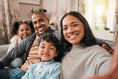 Buy stock photo Selfie, mother and father with children in portrait, happy people at family home with bonding and love in living room. Relax on sofa together, parents and young kids with smile in picture for memory