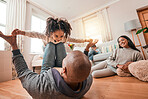 Happy, relax and airplane with family on floor of living room for funny, support and freedom. Smile, happiness and youth with father playing with child at home for care, trust and bonding together