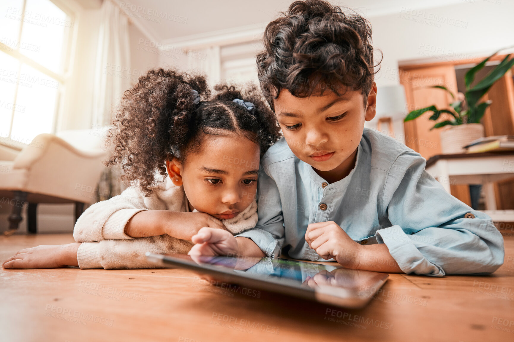 Buy stock photo Children, tablet and home education, online development and internet games for kindergarten or home school. Young kids relax on floor with digital technology for video or app streaming subscription