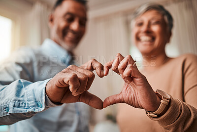 Buy stock photo Heart hands, home and senior couple with a sign, care and happiness with kindness, marriage and health. Commitment, old man or elderly woman with symbol for love, support and like with emoji or smile