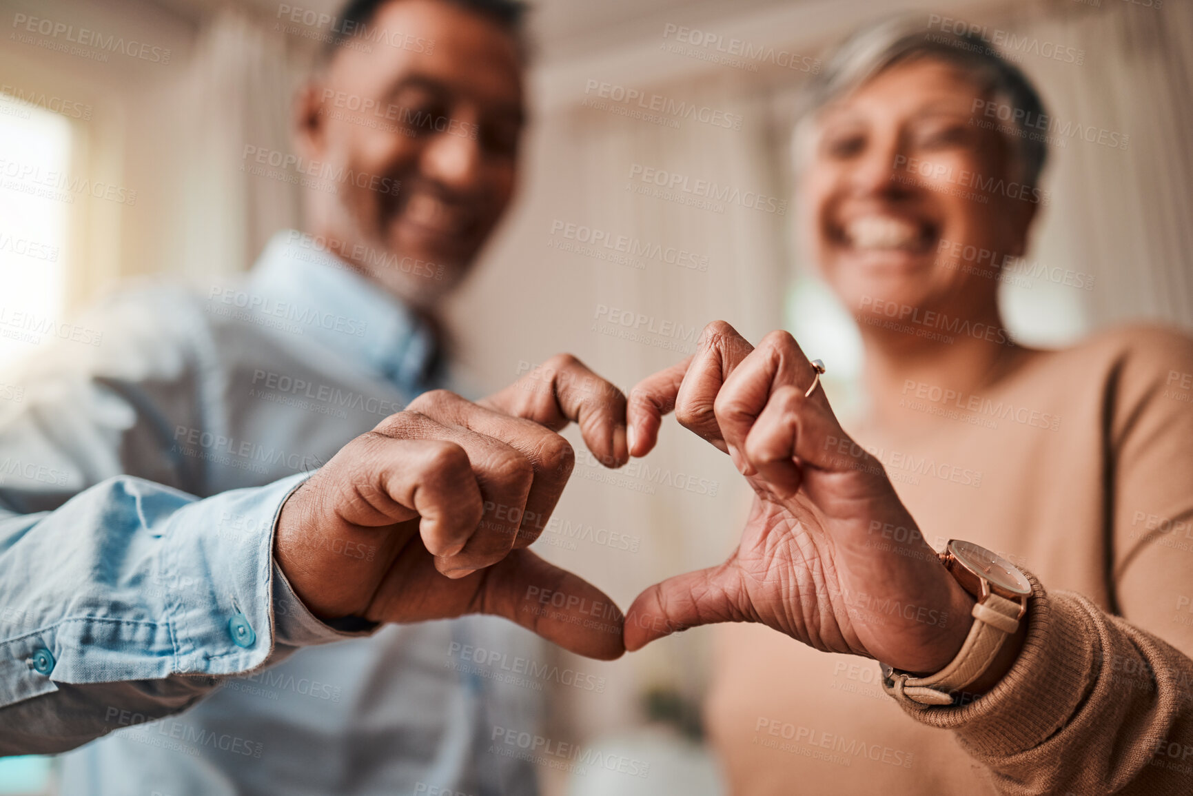 Buy stock photo Heart hands, home and senior couple with a sign, care and happiness with kindness, marriage and health. Commitment, old man or elderly woman with symbol for love, support and like with emoji or smile