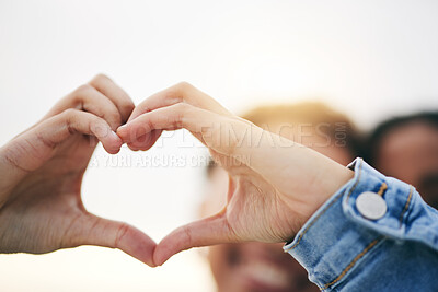Buy stock photo Closeup, support and couple with heart hands, outdoor and relationship with growth, health and icon. Zoom, people and lovers with symbol for romance, care and happiness with gesture and solidarity