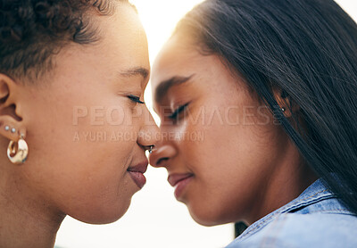 Buy stock photo Lgbtq couple, love and intimate at sunset outdoor, bonding and romance on date together. Partner, gay women and nose touch for care, commitment and loyalty, trust and support for lesbian people