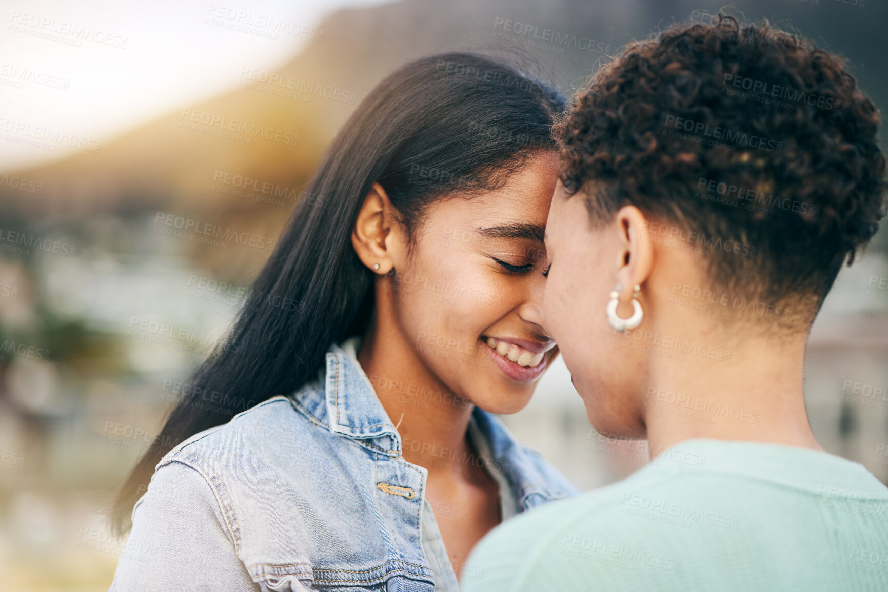Buy stock photo Women, lesbian and couple with forehead touch and love, pride with gen z youth and romance outdoor. Female people together, gay relationship and lgbt with date, partner and trust with hug and support