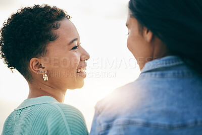 Buy stock photo Sunset, lesbian and couple with love on holiday and smile together on outdoor vacation in the morning with romance. Lgbtq, pride and women bonding on a summer date for adventure, relax and happiness