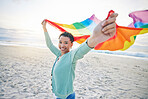 Woman, beach and rainbow pride flag in portrait with smile, wind and waves for lgbtq, inclusion and equality. African girl, fabric or cloth for human rights, lesbian sexuality and happy on vacation
