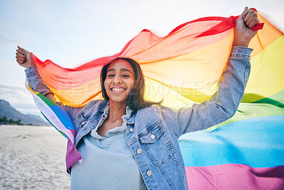 Buy stock photo Woman, beach and rainbow flag for lgbtq in portrait, smile and wind with wave, pride and equality for inclusion. Student girl, fabric or cloth for human rights, lesbian sexuality or happy on vacation