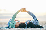 Love, ocean and lesbian couple on blanket holding hands on sand, summer and sunset holiday adventure. Lgbt women, bonding and relax on beach picnic date with romance, pride and happy lying in nature.