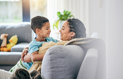 Buy stock photo Family, hug and boy child with mother on a sofa happy, bond and relax in their home together. Love, smile and kid with mom in living room embrace, chilling and enjoying and relationship or weekend