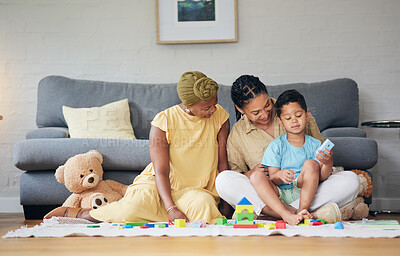 Buy stock photo Playing, gay family and child with toys on a home floor for development, education and learning. Adoption, lesbian or LGBT women or parents and kid together in a lounge for quality time and fun