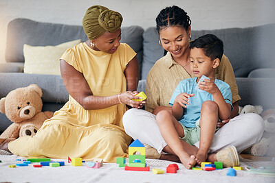 Buy stock photo Toys, child and a gay family playing on a home floor for development, education and learning. Adoption, lesbian or LGBT women or parents and kid together in a lounge for quality time with fun blocks