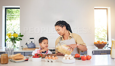 Buy stock photo Breakfast, family and a mother and child cooking, baking or helping with food in the kitchen. House, eating and a boy kid and a young mom teaching during lunch or for dinner together while hungry