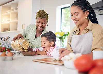 Buy stock photo Breakfast, child and gay family in home kitchen cooking for learning, development and love. Adoption, lesbian or lgbtq women or parents and a happy young kid together for cereal or food with help