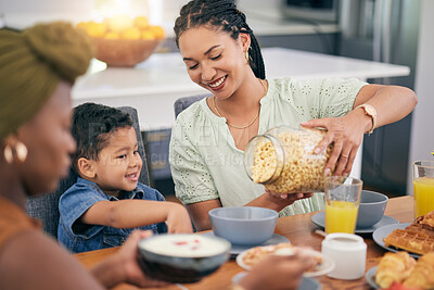 Buy stock photo Breakfast cereal, happiness and family eating, giving meal or enjoy quality time together, brunch event and pour morning food. Relax child, mother or parent serving hungry kid in home dining room