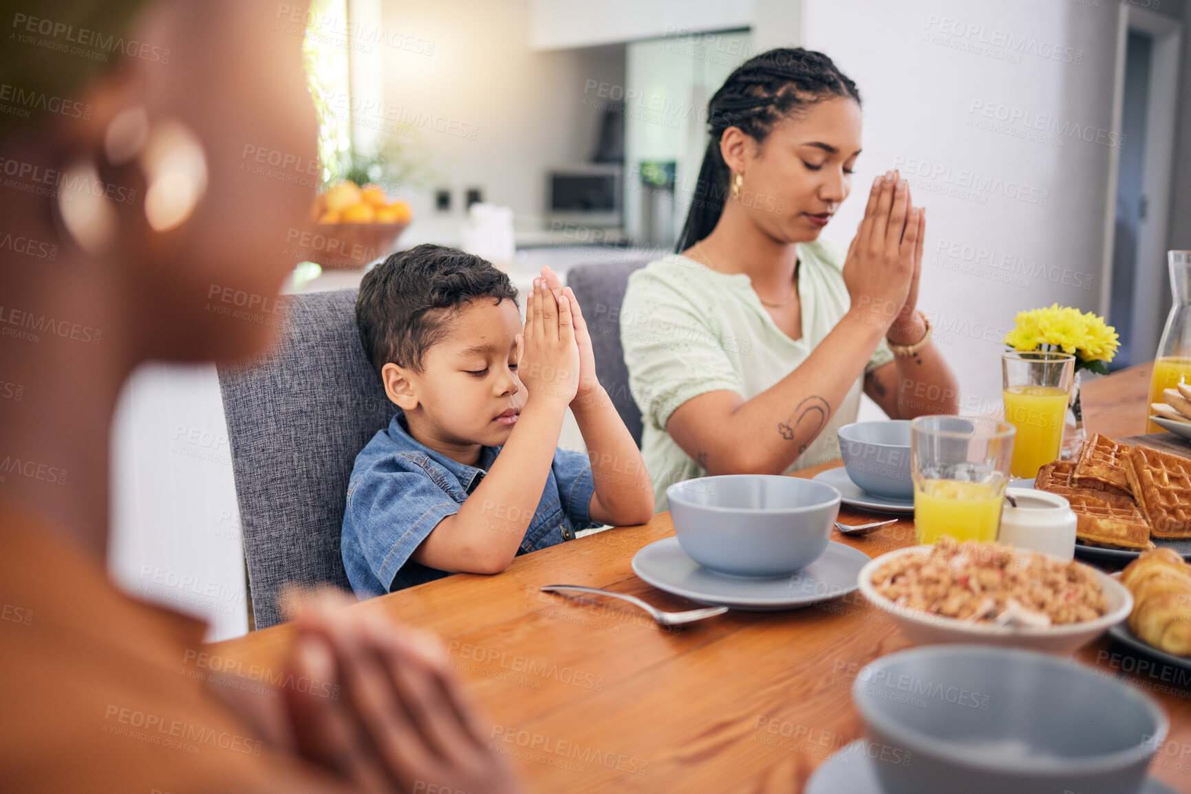Buy stock photo Praying, breakfast and morning with family at table for food, worship or religion. Prayer, gratitude and grace with parents and child in dining room at home for Christian, spiritual or faith together