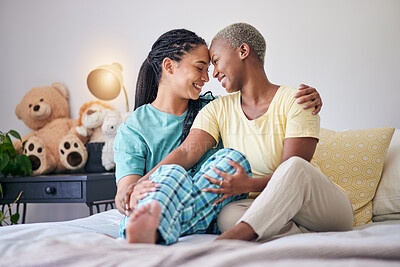 Buy stock photo LGBT, bedroom or couple bond, happiness and smile for home love, support and enjoy quality time together. Forehead, trust or happy gay people, bisexual partner or lesbian women relax on apartment bed