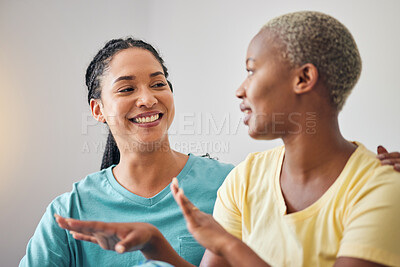 Buy stock photo Home, women and queer couple with a smile, talking and discussion with quality time, relax and bonding. Lesbians, lgbtq and love with support, care and conversation with loving non binary partner